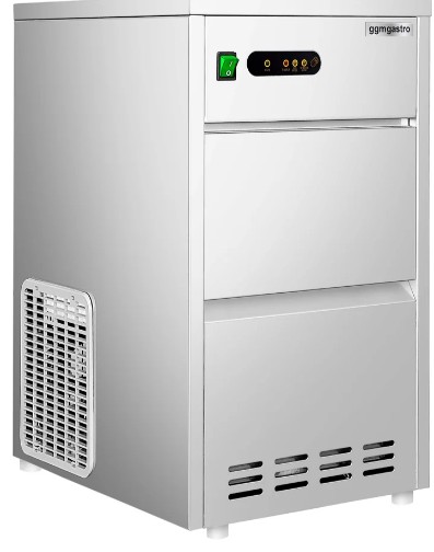 Eight shirts arranged on table in black, olive, grey, blue, white, red, mustard, and green.