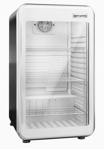 Eight shirts arranged on table in black, olive, grey, blue, white, red, mustard, and green.